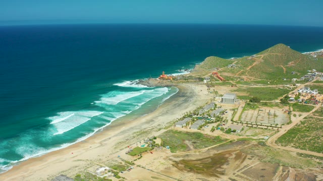 CERRITOS BEACH BCS MEXICO-2021: Waves Breaking on Sandy Coast with Moving Figure