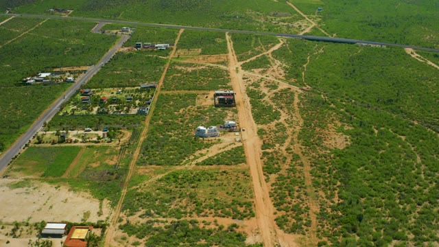 CERRITOS BEACH BCS MEXICO-2021: Vehicles Moving on Paved Road Through Farmland