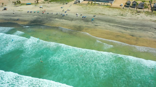 CERRITOS BEACH BCS MEXICO-2021: Beachgoers and Ocean Waves on a Sandy Shore