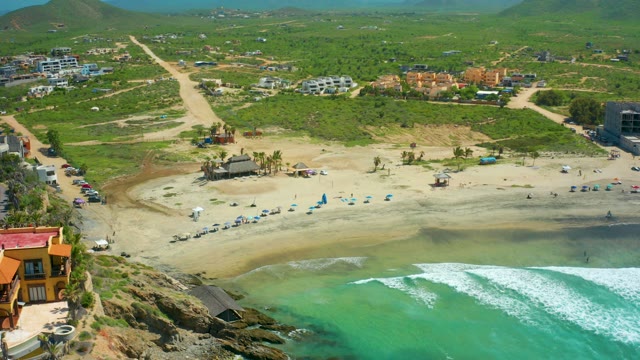 CERRITOS BEACH BCS MEXICO-2021: Coastal Beach with Rolling Ocean Waves and Buildings
