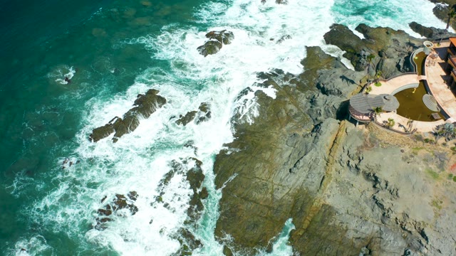 CERRITOS BEACH BCS MEXICO-2021: Waves Crashing on Rocky Coast with Coastal Structure