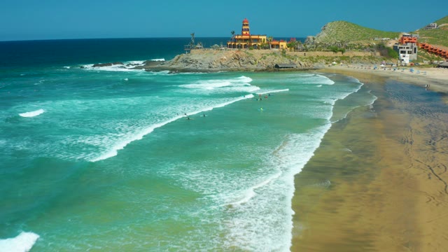 CERRITOS BEACH BCS MEXICO-2021: Waves Rolling Toward Sandy Shore with Lighthouse