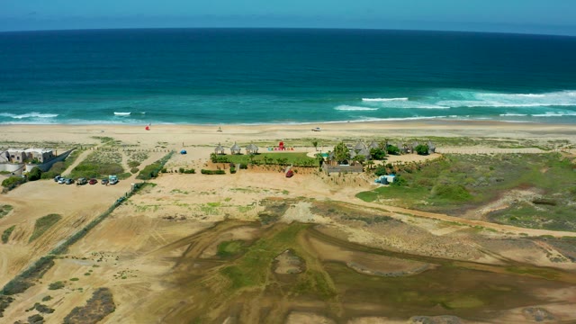CERRITOS BEACH BCS MEXICO-2021: Vehicles and Flags Changing on a Sandy Beach