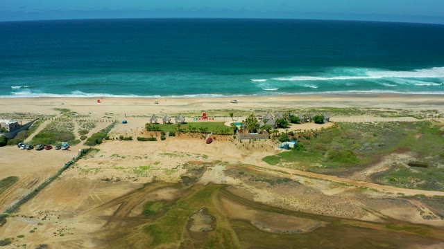 CERRITOS BEACH BCS MEXICO-2021: Kite Descending Over Sandy Beach and Ocean Waves