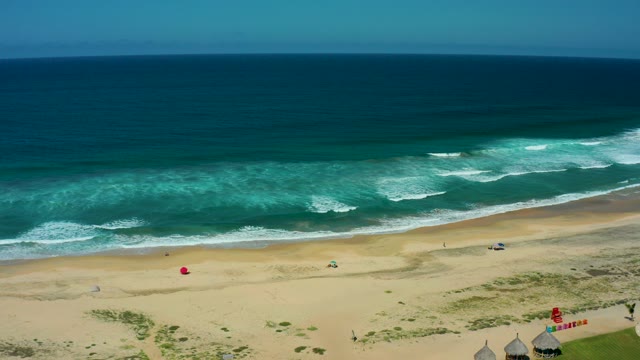 CERRITOS BEACH BCS MEXICO-2021: Aerial View of Beach with Moving Flags and Ocean Waves