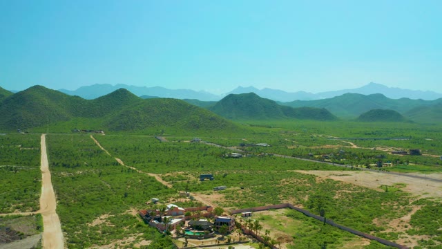 CERRITOS BEACH BCS MEXICO-2021: Rural Valley with Vehicle Moving on Dirt Road