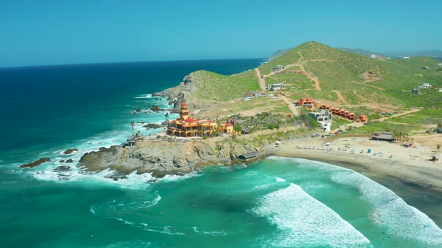 CERRITOS BEACH BCS MEXICO-2021: Coastal Temple on Rocky Shore with Ocean Waves
