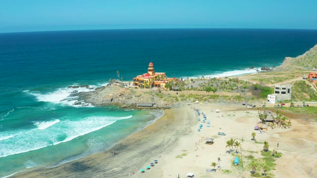 CERRITOS BEACH BCS MEXICO-2021: Beach and Ocean Waves with Cliffside Building