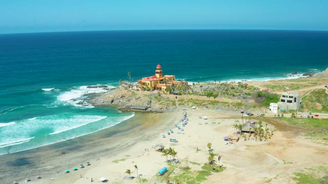 CERRITOS BEACH BCS MEXICO-2021: Waves Crashing on Sandy Beach with Coastal Buildings