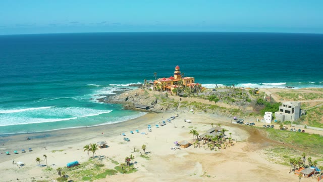 CERRITOS BEACH BCS MEXICO-2021: Lighthouse on Rocky Coast with Crashing Waves
