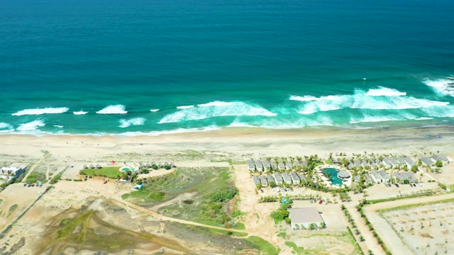 CERRITOS BEACH BCS MEXICO-2021: Waves Breaking on Sandy Shore with Coastal Development