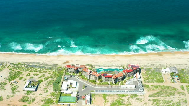 CERRITOS BEACH BCS MEXICO-2021: Waves Rolling Onto Sandy Beach with Coastal Structures
