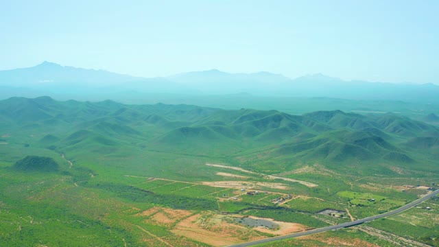 CERRITOS BEACH BCS MEXICO-2021: Vehicle Traveling on Rural Road Through Green Hills