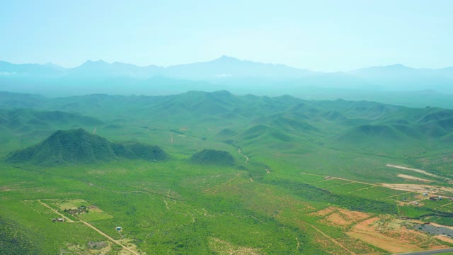 CERRITOS BEACH BCS MEXICO-2021: Rolling Green Hills and Farmland with Vehicle Movement