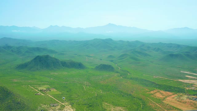 CERRITOS BEACH BCS MEXICO-2021: Rolling Green Hills and Farmland with Vehicle Movement