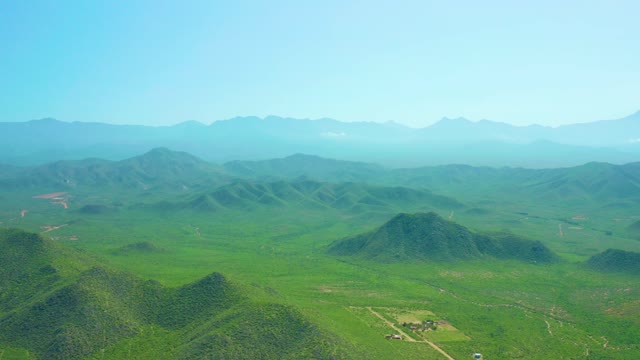 CERRITOS BEACH BCS MEXICO-2021: Rolling Green Hills with Moving Vehicle