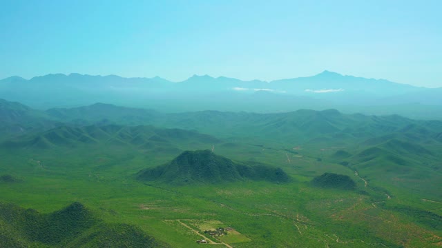 CERRITOS BEACH BCS MEXICO-2021: Aerial Pan Over Lush Mountain Valleys and Ridges