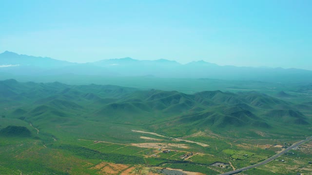 CERRITOS BEACH BCS MEXICO-2021: Hilly Landscape with Road and Drifting Cloud