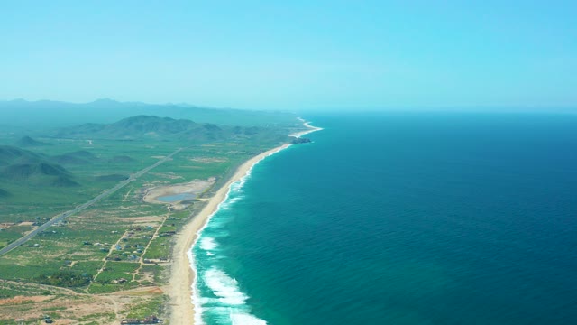 CERRITOS BEACH BCS MEXICO-2021: Coastal Scene with Clearing Sky and Ocean Waves