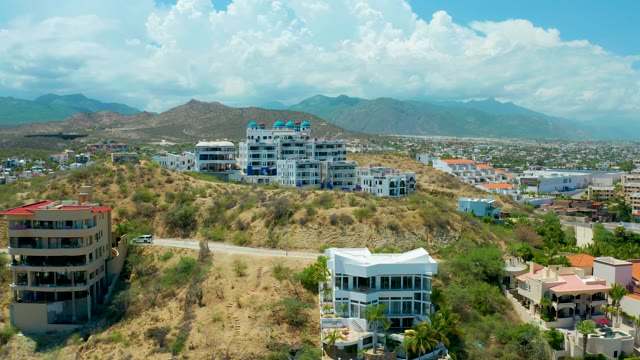 SAN JOSE DEL CABO BCS MEXICO-2021: Hillside Residential Area with Moving Car and Clouds