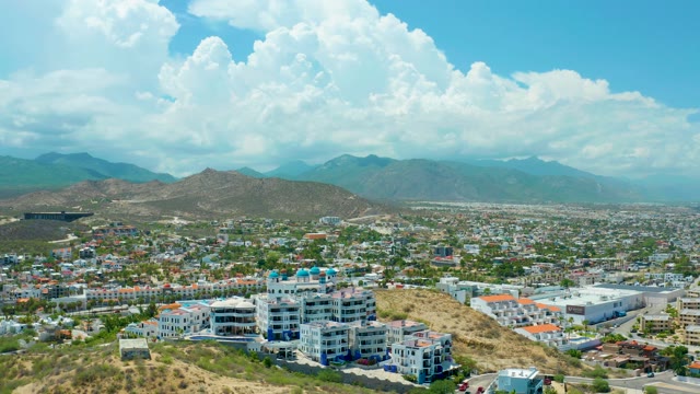 SAN JOSE DEL CABO BCS MEXICO-2021: Clouds Drifting Over City and Mountainous Hillside