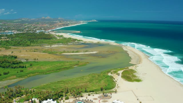 SAN JOSE DEL CABO BCS MEXICO-2021: Coastal River Meeting Sandy Beach with Vehicle Movement