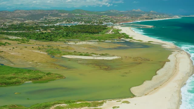 SAN JOSE DEL CABO BCS MEXICO-2021: Coastal Wetlands and Sandy Shore with Moving Clouds