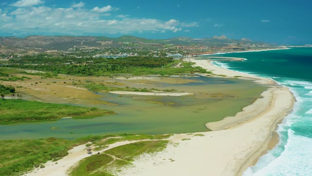 SAN JOSE DEL CABO BCS MEXICO-2021: Estuary Merging with Ocean at Sandy Shore
