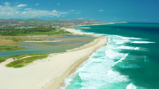 SAN JOSE DEL CABO BCS MEXICO-2021: Waves Breaking on Sandy Shore with Lagoon