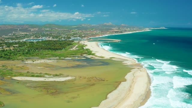 SAN JOSE DEL CABO BCS MEXICO-2021: Coastal Shoreline with Moving Ocean Waves and Sandy Beach