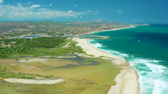 SAN JOSE DEL CABO BCS MEXICO-2021: Receding Tidal Water Exposes Sandy Lagoon