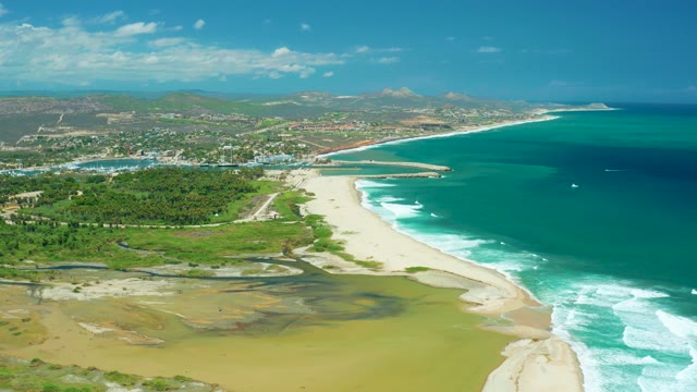 SAN JOSE DEL CABO BCS MEXICO-2021: Receding Lagoon Water on Sandy Coastal Shore