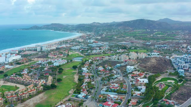 SAN JOSE DEL CABO BCS MEXICO-2021: Coastal Road with Moving Vehicle and Ocean View