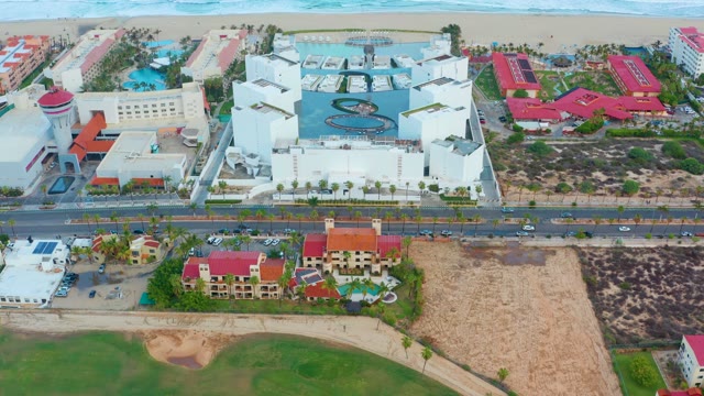 SAN JOSE DEL CABO BCS MEXICO-2021: Ocean Waves Crashing on Beachfront with Buildings