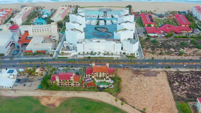 SAN JOSE DEL CABO BCS MEXICO-2021: Coastal Buildings with Ocean Waves and Pool Activity