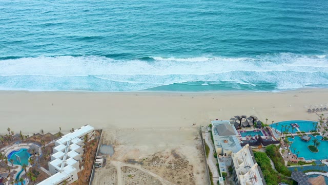 SAN JOSE DEL CABO BCS MEXICO-2021: Beach Resort and Vehicle Moving on Sandy Shore