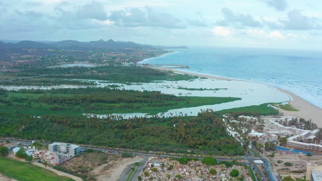SAN JOSE DEL CABO BCS MEXICO-2021: Shifting Cloud Reflections on Coastal Lagoon