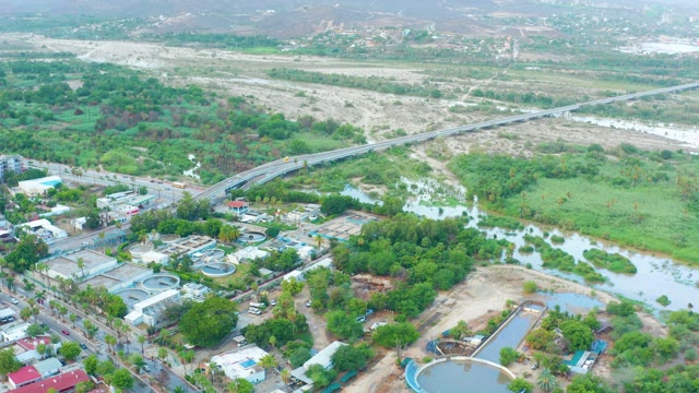 SAN JOSE DEL CABO BCS MEXICO-2021: River, Bridge, and Industrial Area with Moving Traffic