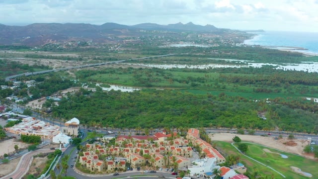 SAN JOSE DEL CABO BCS MEXICO-2021: Aerial Pan Over Residential Area and Lush Fields