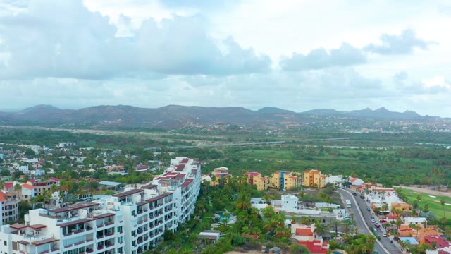 SAN JOSE DEL CABO BCS MEXICO-2021: Aerial Pan of Town and Distant Mountains