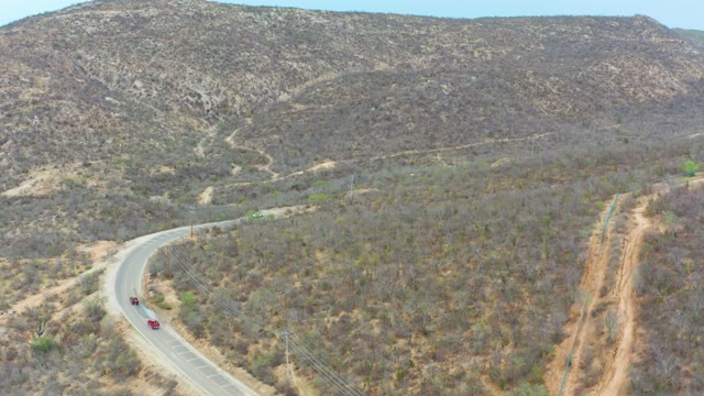 LA PLAYITA LOS CABOS MEXICO-2021: Vehicles Traveling on Winding Mountain Road