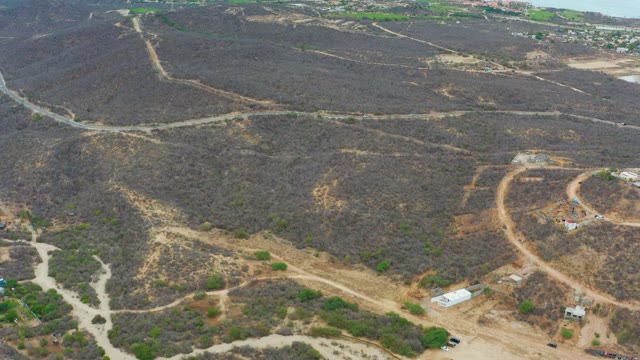LA PLAYITA LOS CABOS MEXICO-2021: Vehicles Moving on Hilly Dirt Roads