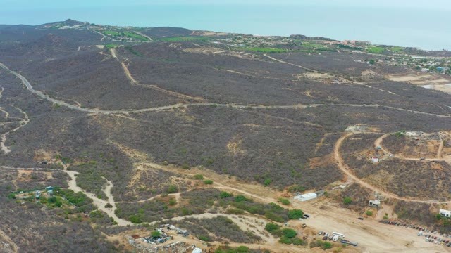 LA PLAYITA LOS CABOS MEXICO-2021: Arid Hills with Winding Dirt Roads Aerial