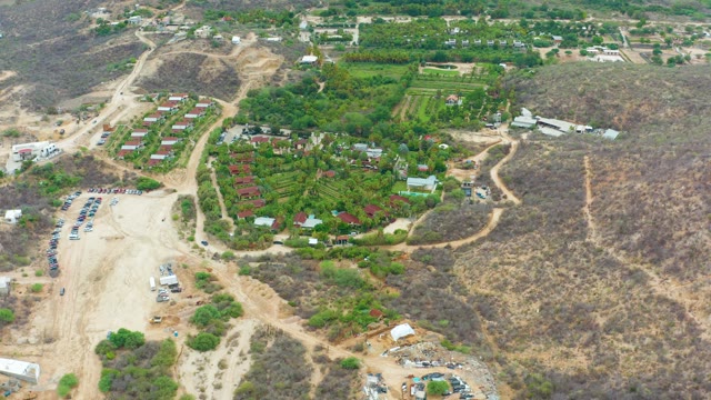 LA PLAYITA LOS CABOS MEXICO-2021: Vehicle Moving Through Hilly Development