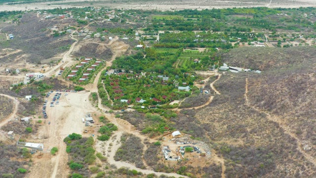 LA PLAYITA LOS CABOS MEXICO-2021: Vehicle Moving on Dirt Road Through Hilly Landscape