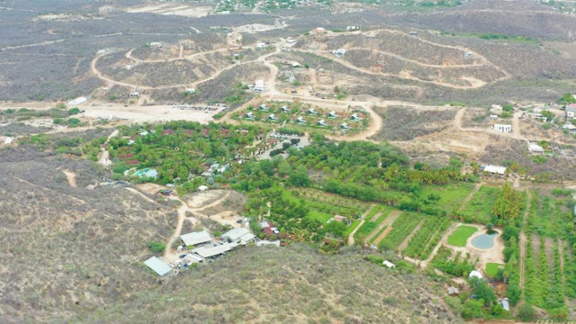 LA PLAYITA LOS CABOS MEXICO-2021: Vehicle Moving on Dirt Paths in a Dry and Green Landscape
