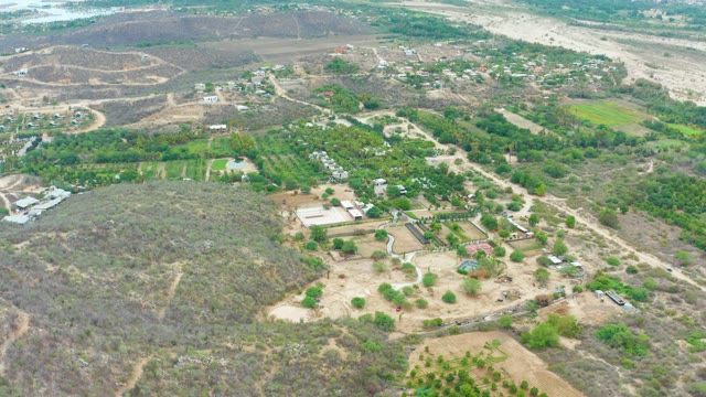 LA PLAYITA LOS CABOS MEXICO-2021: Aerial Pan Over Rural Farming and River Landscape