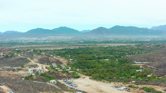 LA PLAYITA LOS CABOS MEXICO-2021: Rural Landscape with Dirt Road and Distant Mountains