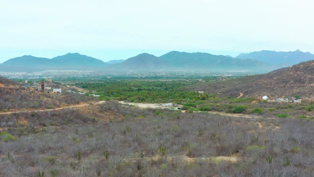 LA PLAYITA LOS CABOS MEXICO-2021: Valley and Mountain Range Aerial Zoom
