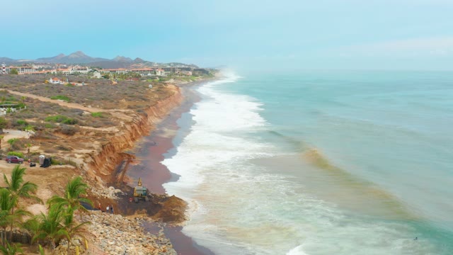 LA PLAYITA LOS CABOS MEXICO-2021: Waves Crashing on Rocky Coast with Cliffs